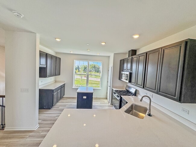 Building Photo - Step into modern living with this brand-ne...
