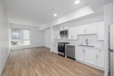 Located at 1999 W 3rd St in the heart of Los Angeles, this well-designed one-bedroom, one-bathroom unit offers a clean, modern aesthetic throughout. Light wood-tone flooring flows seamlessly across every room, creating a cohesive and inviting atmosphere.

The open-concept kitchen and living area serves as the heart of the unit. The kitchen is outfitted with crisp white shaker-style cabinetry, light countertops, and a full suite of stainless steel appliances including a gas range, dishwasher, built-in microwave, and refrigerator. Recessed lighting enhances the bright, airy feel, while a large window in the living area draws in generous natural light and offers views of the surrounding neighborhood.

The bedroom is a comfortable, well-proportioned retreat featuring large windows that frame views of nearby greenery and the urban landscape, filling the room with abundant daylight. Two closets provide practical storage solutions.

The bathroom maintains the unit's clean, modern design with white cabinetry, a single vanity, and a bathtub. A hallway connects the living spaces efficiently, completing the thoughtful layout of this contemporary Los Angeles residence.