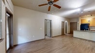 Located at 4652 Miramar Dr in St. Petersburg, Florida, this 2-bedroom, 3-bathroom single-floor residence offers a well-organized and functional layout. The open living area features light wood-style flooring and a ceiling fan, with an arched architectural detail adding character to the space. The kitchen is a standout, showcasing granite countertops, a peninsula island with a built-in sink, warm wood cabinetry, track lighting, pendant lights, and black appliances — all designed for both style and practicality. The bedrooms are bright and comfortable, with light wood flooring, ceiling fans, and windows that bring in natural light and outdoor views. The generously sized primary bedroom includes a walk-in closet with wire shelving for ample storage. All three bathrooms are finished with tile flooring, warm wood vanity cabinetry, and granite-style countertops. The primary bath features an extended vanity with abundant storage, a separate shower with tile surround, and accessibility grab bars. The secondary bath includes a tub-shower combination. A hallway connects the rooms, and two closets provide additional storage throughout the home.