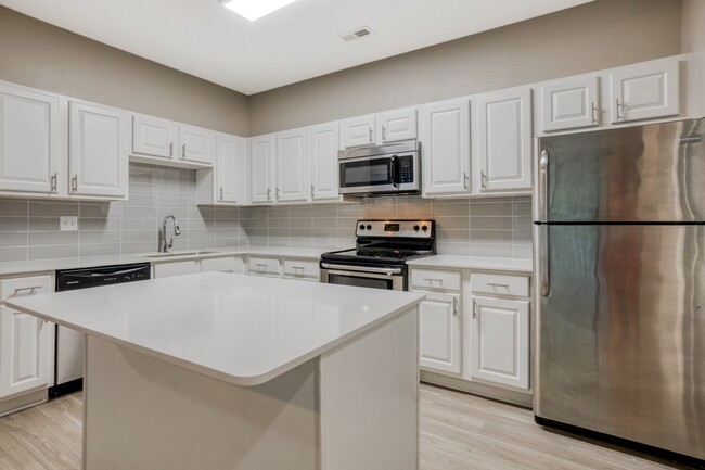 Quartz countertops and stainless steel, energy efficient appliances - Windsor Addison Park