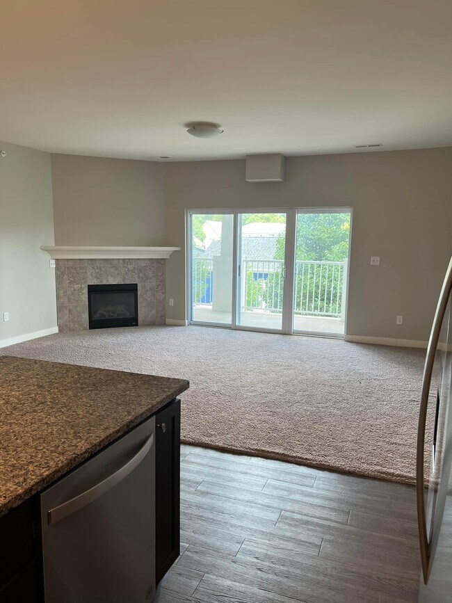 Living room, fireplace, balcony - 2177 Willenbrock Cir
