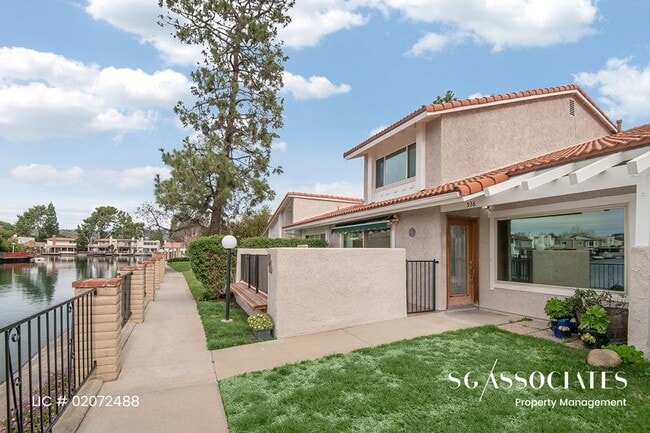 Building Photo - Adorable WATERFRONT Gated Lakeside Villas ...
