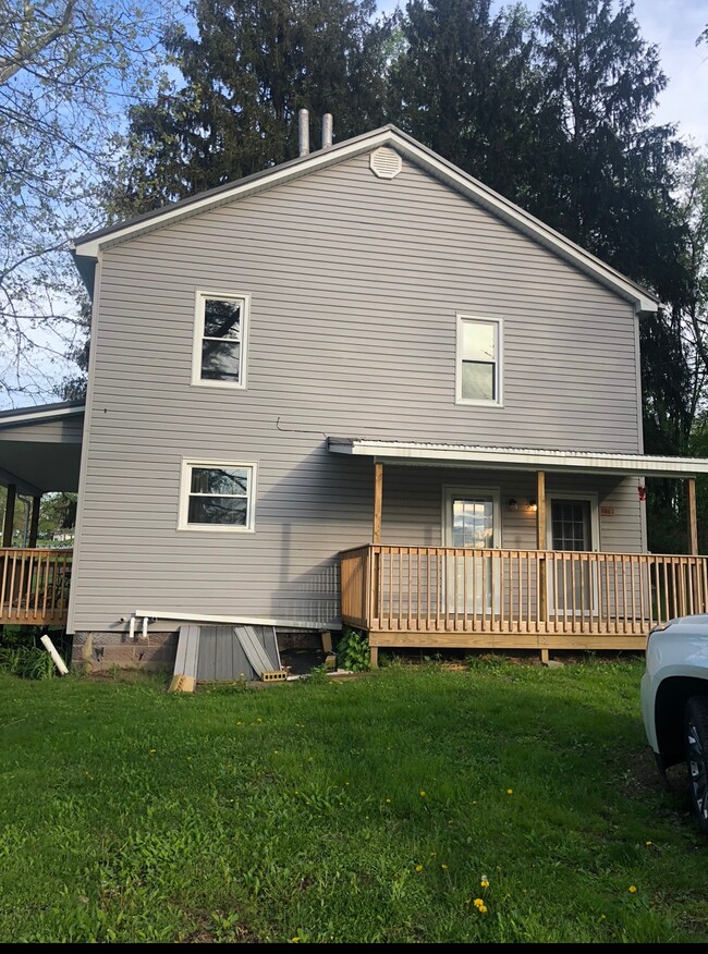 Side entrance for both downstairs and upstairs apartments. Private entrance for both. - 386 Freeport Rd