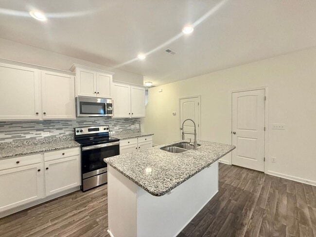 Building Photo - Spacious 3BD, 3.5BA Clayton Townhome with a Large Bonus Space Downstairs and Easy Access to Highways