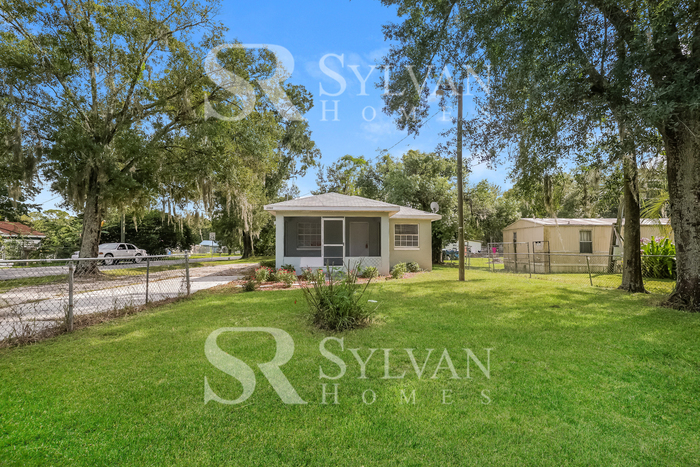 Primary Photo - The living is easy in this 3 bedroom, 1 ba...