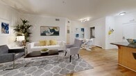 Located at 550 N Figueroa in downtown Los Angeles, this well-appointed three-bedroom, four-bathroom residence offers a thoughtfully designed single-floor layout. Light hardwood flooring flows throughout the open living and dining areas, which are bathed in natural light and accented by clean white walls and crown molding. The combined living room provides ample space for both lounging and dining, with a built-in workspace nook adding functional versatility.

The galley-style kitchen is outfitted with light wood cabinetry, granite countertops, stainless steel appliances, and tile flooring — offering an efficient and well-equipped cooking environment.

Each of the three bedrooms is distinct in character. The primary bedroom features large windows overlooking greenery, light hardwood floors, and a serene, airy ambiance. A second bedroom is highlighted by a bold navy accent wall, hardwood flooring, and generous natural light. The bathrooms are finished with granite-topped vanities, light wood cabinetry, and tile flooring, with tub-shower combinations lending a clean, functional aesthetic.

Two closets provide additional storage, and the overall layout is efficient without sacrificing comfort. The residence presents a modern urban living experience in the heart of Los Angeles.