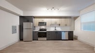 Located at Bear Creek Way NE in Redmond, Washington, this single-floor unit offers a well-designed layout that balances functionality with modern aesthetics. Light wood-style flooring flows consistently throughout the space, creating a cohesive and airy feel.

The kitchen is a standout feature, showcasing a two-tone design with dark charcoal lower cabinets and natural wood-finish upper cabinets, complemented by white quartz-style countertops and a subway tile backsplash. A full suite of stainless steel appliances includes a refrigerator, electric range, over-the-range microwave, and dishwasher. Track lighting overhead ensures ample illumination across the workspace.

The bathroom is clean and contemporary, featuring a wood-finish vanity with an undermount sink, a large frameless mirror, and bright vanity lighting. A tub-shower combination with white tile surround provides a practical bathing space. Notably, a stacked washer and dryer unit is conveniently housed within the bathroom, offering in-unit laundry access.

A generously sized walk-in closet provides substantial storage capacity, equipped with wire shelving systems along the walls. The 3D floor plan reveals a well-proportioned bedroom area with a ceiling fan and windows that allow natural light to enter, rounding out this thoughtfully designed living space.