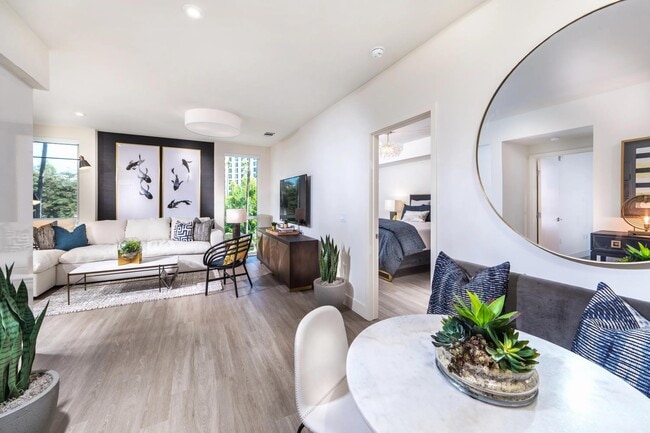 Dining and lounge space offering easy access to the outdoor balcony. - 580 Anton