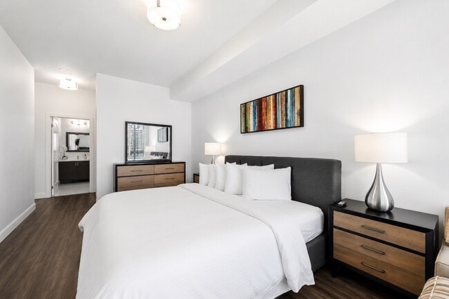Master Bedroom with Queen Bed (King Bed in Select Suites) - The Rosemont Residences