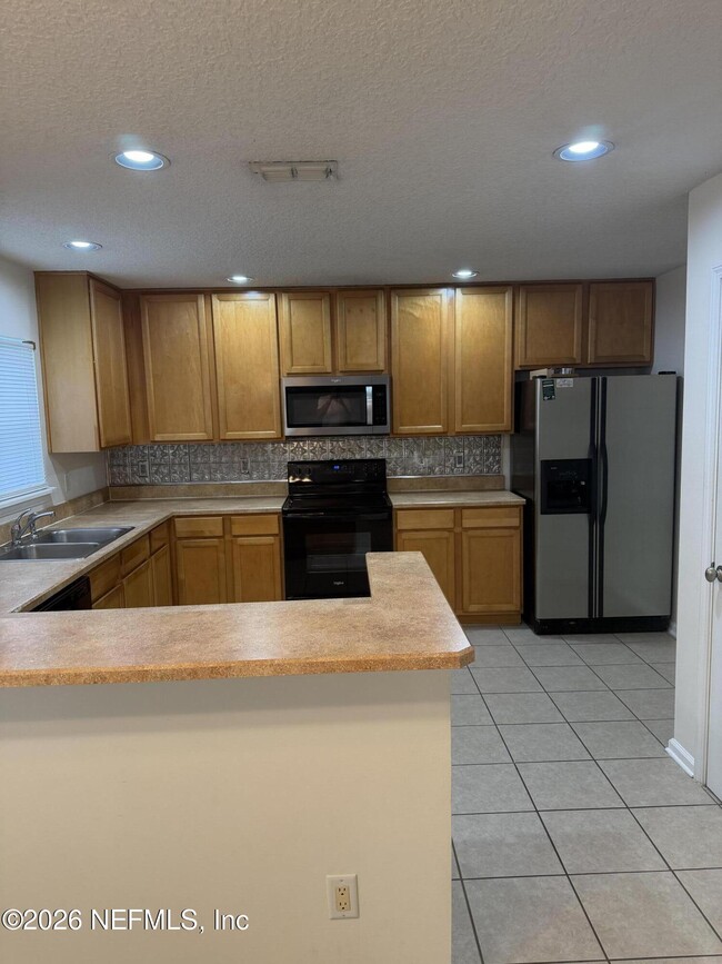 Building Photo - 1603 Canopy Oaks Dr