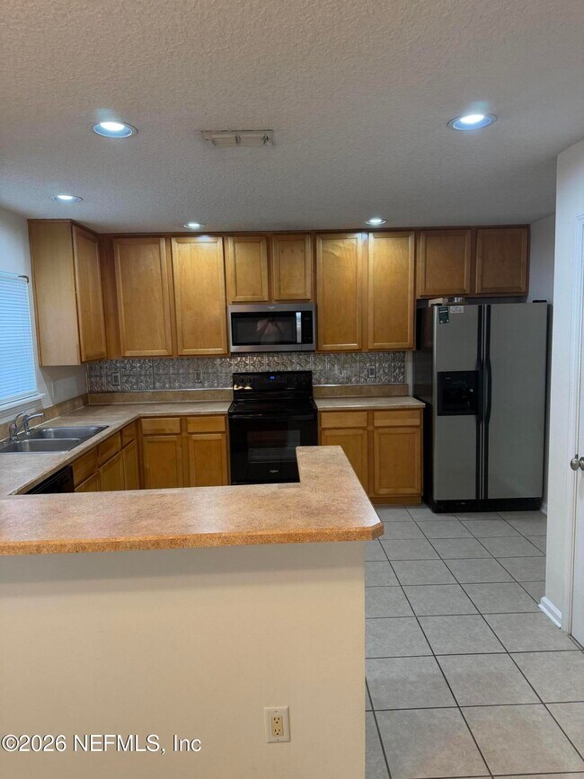 Foto del edificio - 1603 Canopy Oaks Dr