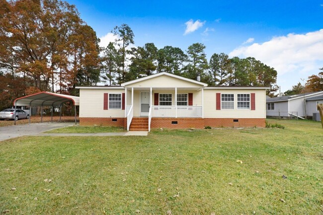 Building Photo - Fresh & Clean! 3 BR, 2 BA Home w/ Carport ...