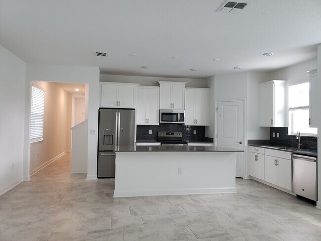 Building Photo - Bridgewalk Corner Lot Home with Wooded View and Solar Panels