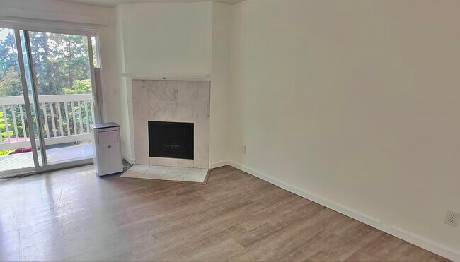 Living Room with Fireplace and a Private Balcony - 9494 Redmond Woodinville Rd NE