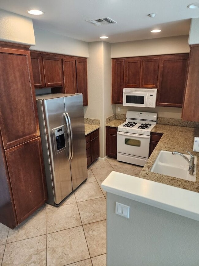 Building Photo - Two Story 3 Bedroom Townhome with 2 Car Garage in Gated Community