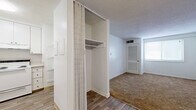 Located at 1906 Chet Atkins Pl in Nashville, Tennessee, this two-bedroom, two-bathroom residence offers a practical and well-organized single-floor layout. The interior features a clean, neutral color palette throughout, with white walls and textured ceilings that keep the space feeling bright and open.

The spacious primary bedroom is carpeted and receives natural light through a window fitted with blinds. It includes a built-in closet with shelving, providing functional storage. The second bedroom is similarly finished with soft carpet flooring and its own window, offering a quiet and comfortable space.

The living area transitions between warm carpet and hardwood-style vinyl flooring, creating a defined yet connected flow through the unit. A ceiling fan in the main living area adds both comfort and practicality. Entry to the unit is through a solid white door, with a closet conveniently positioned near the entrance.

Both bathrooms are neatly finished, with one featuring a full soaking tub surrounded by classic white square tile, complemented by chrome fixtures. A vanity with white cabinetry adds to the clean, functional aesthetic. Hallways connect the rooms efficiently, with hardwood-style flooring underfoot and additional storage access along the way.

Overall, this residence combines straightforward design with practical features, making it a comfortable and functional home in Nashville.