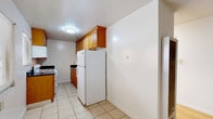 Located at 2025 Francisco St in Berkeley, CA, this single-floor, 2-bedroom, 1-bathroom unit offers a practical and clean layout designed for comfortable everyday living. The interior is finished with warm hardwood flooring throughout the main living areas and bedrooms, lending a cohesive and inviting aesthetic to the space.

The kitchen features warm wood cabinetry, dark countertops, a gas range, and tile flooring, providing ample storage and functional workspace. Appliances including a refrigerator and over-the-range microwave are integrated into the layout.

The primary bedroom is a well-proportioned room equipped with dual mirrored sliding closet doors that enhance the sense of space and reflect natural light. The second bedroom also features hardwood floors, a sliding mirrored closet, and a window with horizontal blinds offering views of the surrounding greenery.

The bathroom includes a full tub-shower combination with a curtain rod, a wood-framed vanity mirror, single-sink vanity with white countertop, and tile flooring in neutral tones.

Throughout the unit, white walls and natural light from multiple windows create a bright, airy atmosphere. The overall design is clean and straightforward, making it a functional and comfortable home in a well-situated Berkeley neighborhood.