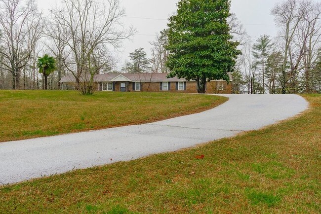 Building Photo - Beautiful Brick Home with Garage and Carport!