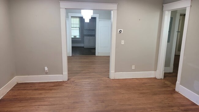 Entry living room opens into dining and bedroom hallway - 309 Dargan Pl SW