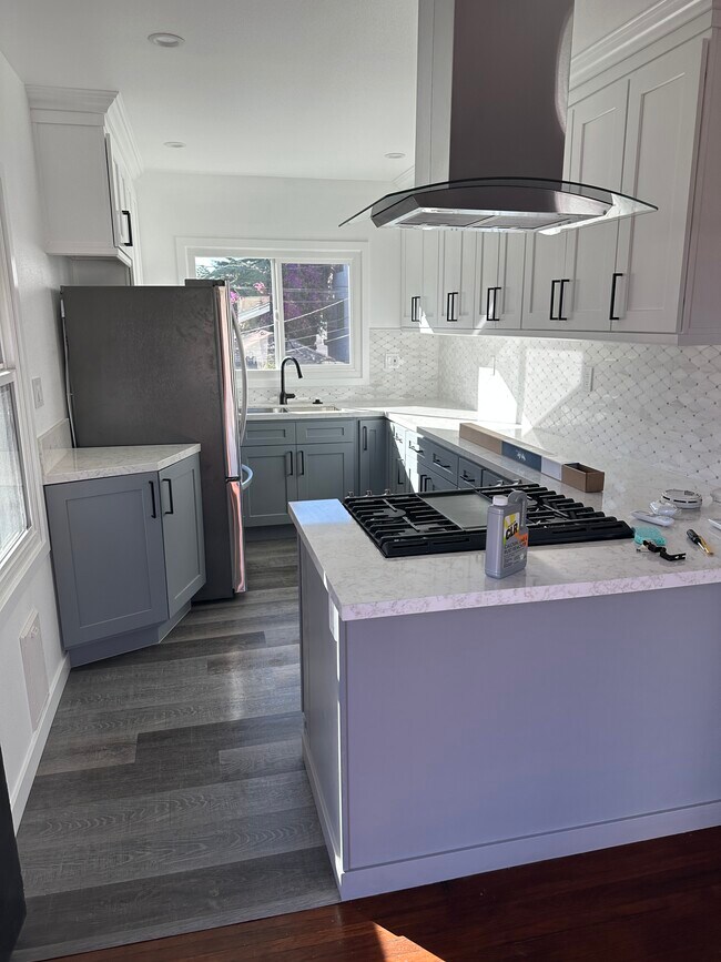 View of new kitchen from living room - 423 E 8th St