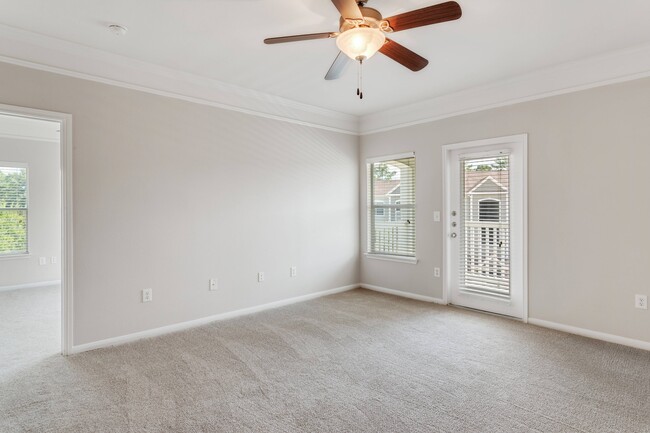 Living Room with Balcony - Carrington Park at Huffmeister Apartments