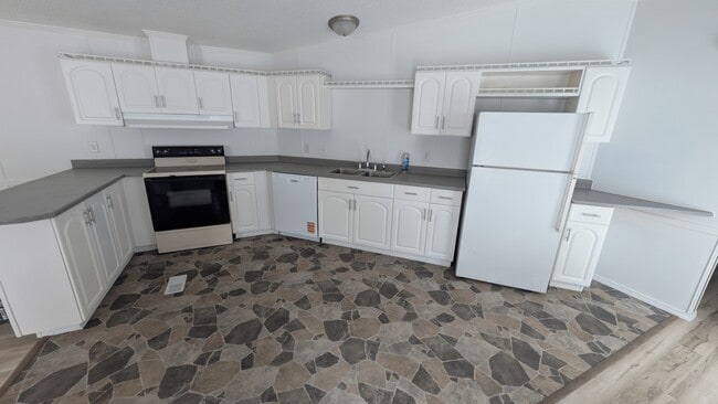 Kitchen with freshly painted cabinets and new hardware. - 5237 Highway NN