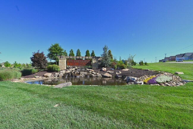 Building Photo - **BE THE LUCKY ONE TO LIVE IN THIS 2024-BUILT END-UNIT TOWNHOME IN A RESORT-STYLE COMMUNITY**