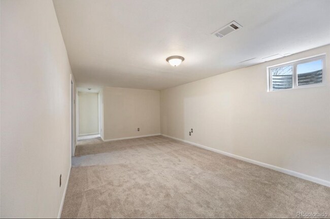 Walk into your living room that has been freshly painted with new carpets. - 7310 Utica St