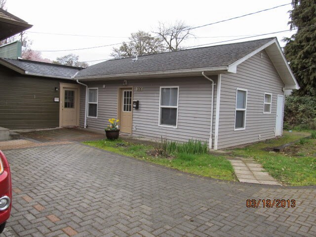 View of north side off 10th St parking area - 306 NW 10th St