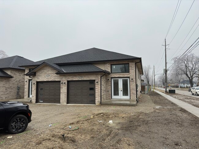 Photo du bâtiment - Brand New 2-Bedroom Townhome – Available I...