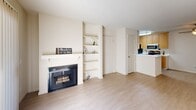 Located at 1490 Bel Air Dr in Concord, CA, this single-story 1-bedroom, 1-bathroom home is thoughtfully laid out across a comfortable and efficient floor plan. Light-toned laminate flooring flows throughout the main living areas, complemented by neutral wall tones that create a clean, bright ambiance.

The living room is a welcoming focal point, featuring a fireplace with a classic white mantle and an adjacent built-in shelving unit—ideal for display or storage. Sliding glass doors invite abundant natural light and open directly to a private patio, seamlessly connecting indoor and outdoor living.

The galley-style kitchen is well-appointed with light wood cabinetry, white countertops, and stainless steel appliances including a range, microwave, refrigerator, and dishwasher. A dedicated dining area sits adjacent to the kitchen, providing a defined space for meals.

The spacious bedroom features plush carpeting, a ceiling fan, a natural light source from a window, and a mirrored sliding-door closet that adds both function and a sense of depth. Additional closets throughout the hallway provide ample storage. The bathroom includes a tub/shower combination with sliding glass doors, a vanity, and light flooring consistent with the rest of the home.