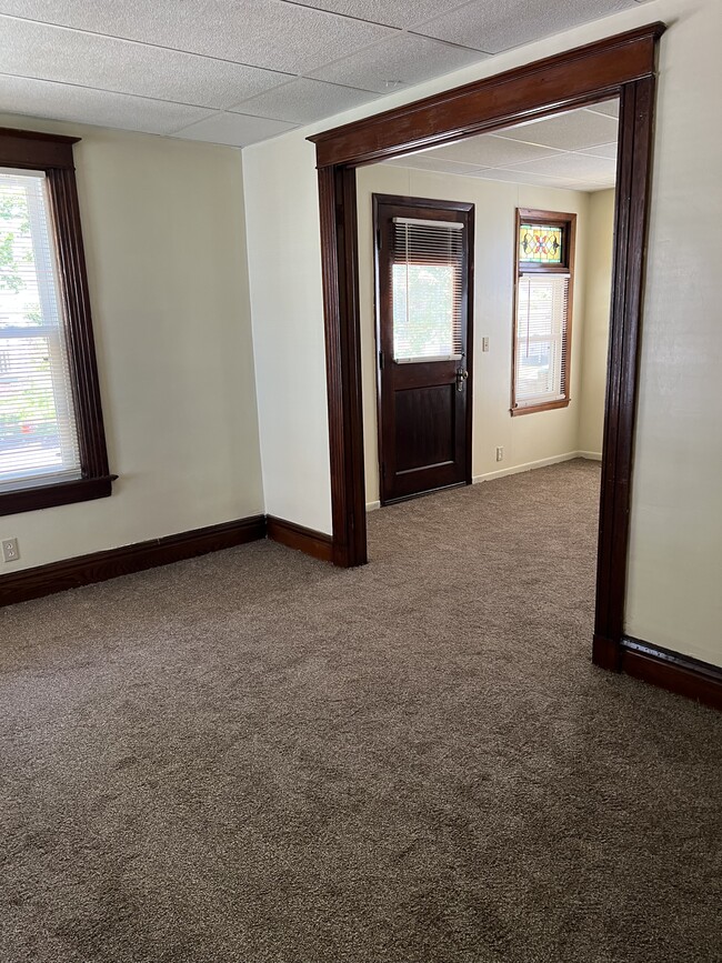 Living room and family room. Original wood trim - 23 Garson Ave