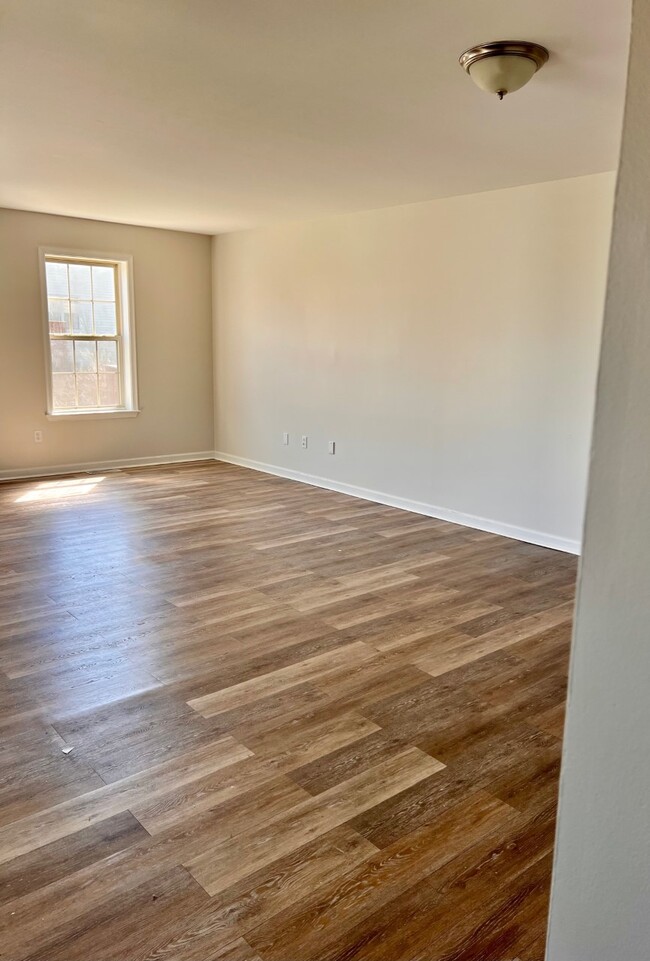 Livingroom next to the kitchen. - 320 Moty Dr