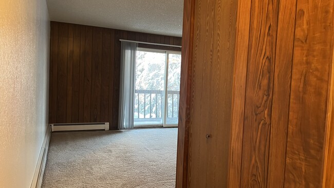 Entry Storage Closet & Living Room - Willow Woods Apartments