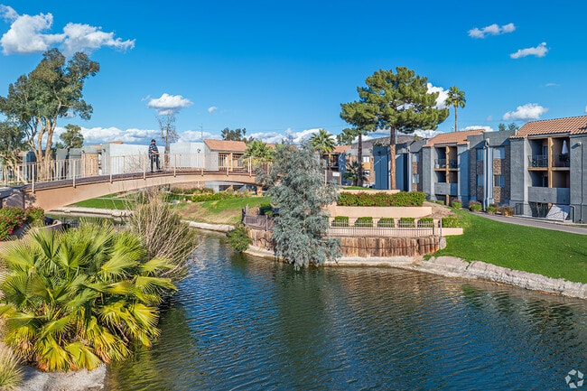 Enjoy serene lake views from a bridge outside of apartments in North Mountain.
