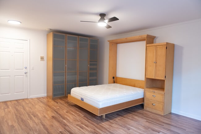 Main room with murphy bed open - 701 NE 28th Ave
