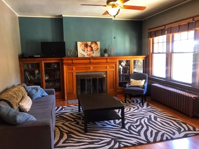 Living room, which opens to dining area, has its original craftsman charm. - 7 Pawnee Ave
