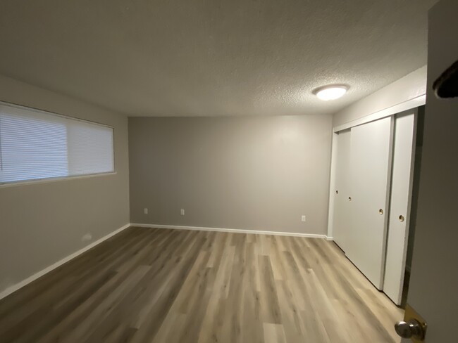 Bedroom with ample storage - 19871 NW Rock Creek Blvd