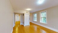Located at 20 Eden St, Unit 4 in Worcester, MA, this three-bedroom, one-bathroom residence offers a well-designed single-floor layout with a comfortable and cohesive feel throughout. Warm-toned hardwood flooring runs consistently across all rooms, lending a bright and unified character to the space.

The open living area is generously sized, with neutral-toned walls and flush-mount lighting that create a clean, welcoming atmosphere. The kitchen features warm wood cabinetry with ample upper and lower storage, dark countertops, and a track lighting fixture, complemented by natural light from an adjacent window.

Each of the three bedrooms is well-proportioned, with the primary bedroom offering a notably comfortable footprint. The bedrooms are finished with the same hardwood flooring and neutral walls, and several rooms feature multiple windows that bring in natural light and views of the surrounding greenery and neighborhood.

The bathroom is neatly appointed with a full tub-shower combination, brushed nickel fixtures, and tile flooring in a neutral stone finish, providing a clean and functional space.

Throughout the unit, crisp white trim, panel-style doors, and a consistent neutral palette contribute to a tidy, move-in-ready presentation. The layout flows intuitively, making efficient use of the available space.