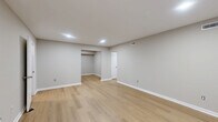 Located at 201 Kingstowne Rd in Newport News, VA, this single-story 2-bedroom, 1-bathroom home offers a clean, updated interior with a neutral color palette throughout. The layout includes a living room, dining room, kitchen, two bedrooms, a full bathroom, laundry area, hallway, and four closets, providing well-organized and functional living space.

The living room features light wood-style flooring, recessed lighting, and a window overlooking the outdoors, creating a bright and welcoming atmosphere. The galley-style kitchen is equipped with white shaker cabinetry, granite-look countertops, a stainless steel sink, dishwasher, and electric range with overhead ventilation — all set on matching light wood-style flooring.

Both bedrooms are carpeted in a soft neutral tone. The spacious primary bedroom boasts two wide bi-fold closets, offering generous storage. The second bedroom includes a bi-fold closet and a window with natural light. The hallway connects to the full bathroom, which features a white vanity with marble-look countertop and a tub/shower combo with built-in shelving. A louvered-door laundry closet is conveniently accessible from the hallway, completing this thoughtfully arranged home.