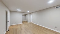 Located at 201 Kingstowne Rd in Newport News, VA, this single-story 2-bedroom, 1-bathroom home offers a clean, updated interior with a neutral color palette throughout. The layout includes a living room, dining room, kitchen, two bedrooms, a full bathroom, laundry area, hallway, and four closets, providing well-organized and functional living space.

The living room features light wood-style flooring, recessed lighting, and a window overlooking the outdoors, creating a bright and welcoming atmosphere. The galley-style kitchen is equipped with white shaker cabinetry, granite-look countertops, a stainless steel sink, dishwasher, and electric range with overhead ventilation — all set on matching light wood-style flooring.

Both bedrooms are carpeted in a soft neutral tone. The spacious primary bedroom boasts two wide bi-fold closets, offering generous storage. The second bedroom includes a bi-fold closet and a window with natural light. The hallway connects to the full bathroom, which features a white vanity with marble-look countertop and a tub/shower combo with built-in shelving. A louvered-door laundry closet is conveniently accessible from the hallway, completing this thoughtfully arranged home.