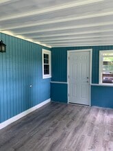 Enclosed porch door to backyard - 67 E Creek Cir