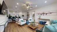 Located on Canary Lane in Bentonville, Arkansas, this single-story space offers a well-organized layout designed for both comfort and functionality. Warm wood-look flooring runs continuously throughout, providing a cohesive foundation across all areas.

The open-concept living and dining area forms the heart of the space. A ceiling fan with integrated lighting anchors the living room, which receives natural light through large windows fitted with white blinds. Recessed lighting supplements the ambiance throughout. The dining area sits adjacent to the kitchen, separated by a peninsula with pendant lighting overhead.

The kitchen is well-appointed with white shaker-style cabinetry, granite-look countertops, and a full suite of stainless steel appliances including a refrigerator, range, microwave, and dishwasher. Ample counter and cabinet space make it highly functional.

A dedicated office room features a large window with natural light, providing a bright and focused workspace. The bedroom is a calm, well-lit retreat with a sizable window overlooking the outdoors. The bathroom continues the design palette with white cabinetry, granite-look countertops, and wood-look flooring. The overall aesthetic is clean, modern, and consistently executed throughout.