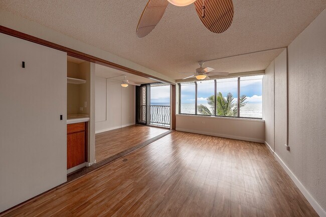 Building Photo - BEACH FRONT Partly Furnished 2/2/1 cov pkg...