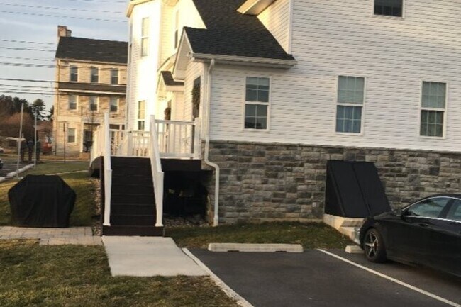 Private parking and entrance - 7810 Main St