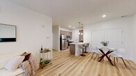 Located at 2715 Manitou Rd, this well-appointed single-floor residence offers 1 bedroom, 2 bathrooms, a dedicated office, and a thoughtfully designed open-concept living area. Light hardwood-style flooring flows through the main living spaces, lending a clean, cohesive aesthetic throughout.

The combined kitchen and living room serves as the heart of the home. The kitchen features taupe cabinetry, stainless steel appliances including a refrigerator, microwave, and range, and a peninsula with a double sink and bar seating illuminated by pendant lighting. The living room is bright and spacious, with sliding glass doors that invite natural light and provide outdoor access, complemented by a ceiling fan overhead.

The generously sized primary bedroom is carpeted and bathed in natural light through a large window, offering a calm and comfortable retreat. The dedicated office, also carpeted, includes a sizable window with outdoor views, making it a functional and pleasant workspace.

Two bathrooms serve the residence; one features wood-look flooring, a walk-in shower, and a vanity with storage. A closet and hallway provide additional practical storage. The overall ambiance is modern, neutral, and move-in ready, with clean lines and consistent finishes throughout.