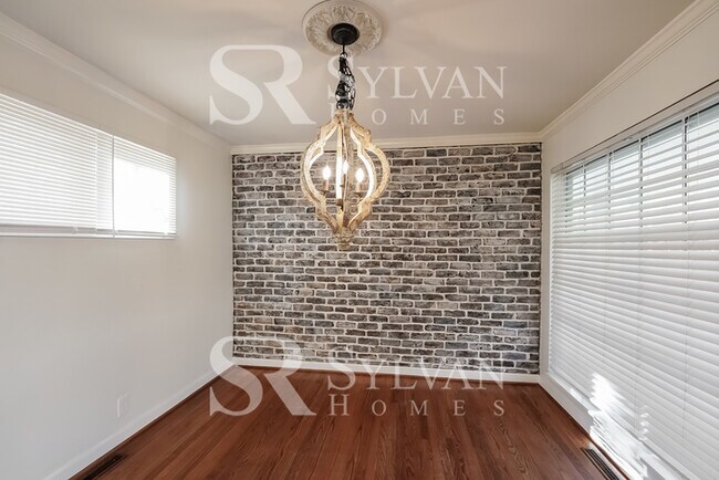 Building Photo - The living is easy in this 4 bedroom, 3 ba...