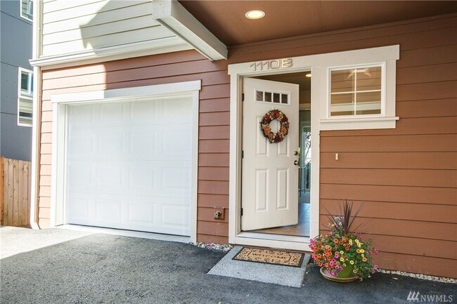 Attached garage with direct entrance from within unit. Remote control garage door. Extra storage. - 1110 29th Ave S Townhome