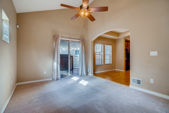 Living room looking towards dining room and sliding door to the patio - 10148 E 29th Dr