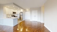 This thoughtfully laid-out 2-bedroom, 1-bathroom unit is defined by its classic parquet wood flooring, which extends consistently throughout every room, adding warmth and a timeless character to the space. The open-concept living and dining area is generously proportioned, bathed in natural light through large sliding glass doors that lead to a private balcony with outdoor views — a standout feature of the unit. A baseboard heating system runs along the perimeter of the living space, ensuring year-round comfort.

The kitchen is efficiently designed with white cabinetry, a clean white countertop, and a full suite of stainless steel appliances including a refrigerator, stove, and built-in microwave. Recessed lighting illuminates the kitchen area, complementing the natural light from the living space.

Both bedrooms are comfortably sized, each featuring large windows that frame outdoor views and allow ample natural light. The primary bedroom includes a double-door closet, providing substantial storage. The second bedroom also features a double-door closet along with direct hallway access.

The bathroom is finished with crisp white subway tile surrounding a full bathtub and shower, giving it a clean, classic aesthetic. A hallway with an additional closet connects the rooms, completing this functional and well-maintained layout.